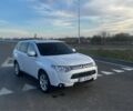 Белый Мицубиси Аутлендер, объемом двигателя 2.4 л и пробегом 185 тыс. км за 13500 $, фото 1 на Automoto.ua