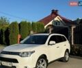 Белый Мицубиси Аутлендер, объемом двигателя 2.36 л и пробегом 163 тыс. км за 13500 $, фото 1 на Automoto.ua