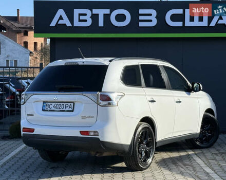 Белый Мицубиси Аутлендер, объемом двигателя 2.4 л и пробегом 148 тыс. км за 12900 $, фото 1 на Automoto.ua