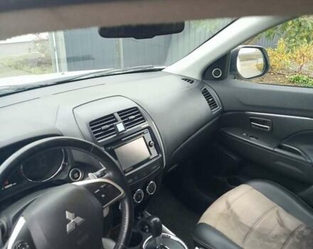 Белый Мицубиси Аутлендер, объемом двигателя 2 л и пробегом 203 тыс. км за 10750 $, фото 3 на Automoto.ua