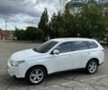 Белый Мицубиси Аутлендер, объемом двигателя 2.4 л и пробегом 210 тыс. км за 11700 $, фото 1 на Automoto.ua
