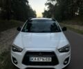 Белый Мицубиси Аутлендер, объемом двигателя 2 л и пробегом 260 тыс. км за 11000 $, фото 1 на Automoto.ua