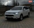 Белый Мицубиси Аутлендер, объемом двигателя 2.4 л и пробегом 196 тыс. км за 13000 $, фото 1 на Automoto.ua