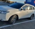 Белый Мицубиси Аутлендер, объемом двигателя 2.4 л и пробегом 175 тыс. км за 13800 $, фото 4 на Automoto.ua
