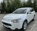 Белый Мицубиси Аутлендер, объемом двигателя 2.4 л и пробегом 210 тыс. км за 11700 $, фото 1 на Automoto.ua