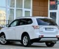 Белый Мицубиси Аутлендер, объемом двигателя 2.36 л и пробегом 140 тыс. км за 12999 $, фото 3 на Automoto.ua