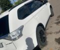 Белый Мицубиси Аутлендер, объемом двигателя 2 л и пробегом 225 тыс. км за 13500 $, фото 1 на Automoto.ua