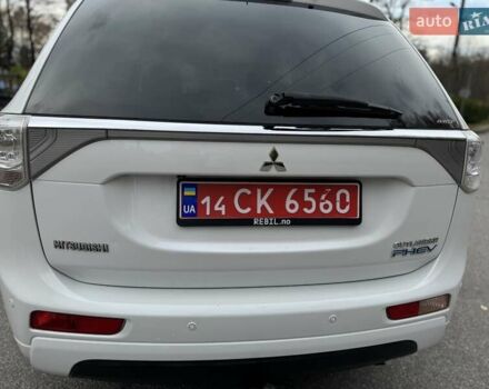 Белый Мицубиси Аутлендер, объемом двигателя 2 л и пробегом 210 тыс. км за 14300 $, фото 27 на Automoto.ua