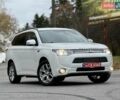 Белый Мицубиси Аутлендер, объемом двигателя 2 л и пробегом 210 тыс. км за 14300 $, фото 2 на Automoto.ua