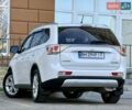 Белый Мицубиси Аутлендер, объемом двигателя 2.36 л и пробегом 140 тыс. км за 12999 $, фото 2 на Automoto.ua