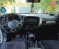 Белый Мицубиси Аутлендер, объемом двигателя 2.36 л и пробегом 145 тыс. км за 15200 $, фото 6 на Automoto.ua