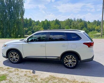 Белый Мицубиси Аутлендер, объемом двигателя 2.36 л и пробегом 142 тыс. км за 15100 $, фото 4 на Automoto.ua