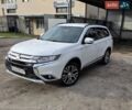 Белый Мицубиси Аутлендер, объемом двигателя 2.36 л и пробегом 169 тыс. км за 13300 $, фото 1 на Automoto.ua