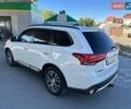Белый Мицубиси Аутлендер, объемом двигателя 2.36 л и пробегом 185 тыс. км за 14200 $, фото 2 на Automoto.ua