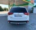 Белый Мицубиси Аутлендер, объемом двигателя 2.36 л и пробегом 185 тыс. км за 14200 $, фото 1 на Automoto.ua
