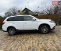 Белый Мицубиси Аутлендер, объемом двигателя 2.36 л и пробегом 191 тыс. км за 13950 $, фото 3 на Automoto.ua