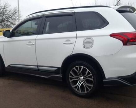 Белый Мицубиси Аутлендер, объемом двигателя 2.4 л и пробегом 240 тыс. км за 14900 $, фото 4 на Automoto.ua