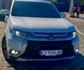 Белый Мицубиси Аутлендер, объемом двигателя 2.36 л и пробегом 240 тыс. км за 14000 $, фото 1 на Automoto.ua