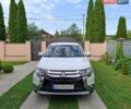 Белый Мицубиси Аутлендер, объемом двигателя 2.4 л и пробегом 145 тыс. км за 14900 $, фото 1 на Automoto.ua