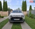 Белый Мицубиси Аутлендер, объемом двигателя 2.36 л и пробегом 144 тыс. км за 15499 $, фото 1 на Automoto.ua