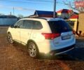 Белый Мицубиси Аутлендер, объемом двигателя 2.4 л и пробегом 140 тыс. км за 13800 $, фото 1 на Automoto.ua