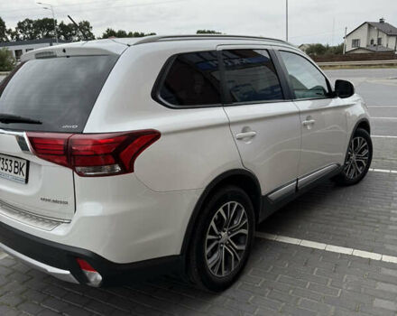 Белый Мицубиси Аутлендер, объемом двигателя 2.36 л и пробегом 134 тыс. км за 18500 $, фото 1 на Automoto.ua