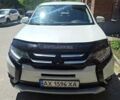 Белый Мицубиси Аутлендер, объемом двигателя 2.36 л и пробегом 140 тыс. км за 14650 $, фото 1 на Automoto.ua