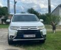 Белый Мицубиси Аутлендер, объемом двигателя 2.36 л и пробегом 130 тыс. км за 14099 $, фото 1 на Automoto.ua