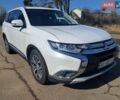 Белый Мицубиси Аутлендер, объемом двигателя 2.36 л и пробегом 129 тыс. км за 15300 $, фото 1 на Automoto.ua