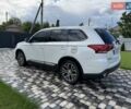 Білий Міцубісі Аутлендер, об'ємом двигуна 2.36 л та пробігом 181 тис. км за 13000 $, фото 4 на Automoto.ua