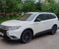 Белый Мицубиси Аутлендер, объемом двигателя 2.4 л и пробегом 103 тыс. км за 19000 $, фото 1 на Automoto.ua