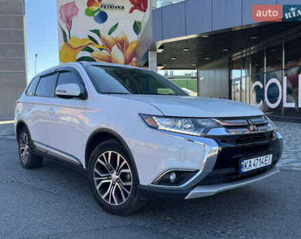 Белый Мицубиси Аутлендер, объемом двигателя 2.4 л и пробегом 210 тыс. км за 13550 $, фото 1 на Automoto.ua