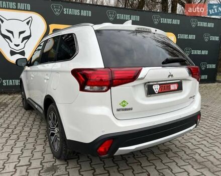 Белый Мицубиси Аутлендер, объемом двигателя 2.36 л и пробегом 153 тыс. км за 15700 $, фото 6 на Automoto.ua