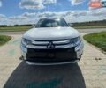 Белый Мицубиси Аутлендер, объемом двигателя 2 л и пробегом 160 тыс. км за 15000 $, фото 1 на Automoto.ua