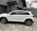 Белый Мицубиси Аутлендер, объемом двигателя 2.36 л и пробегом 107 тыс. км за 15500 $, фото 1 на Automoto.ua