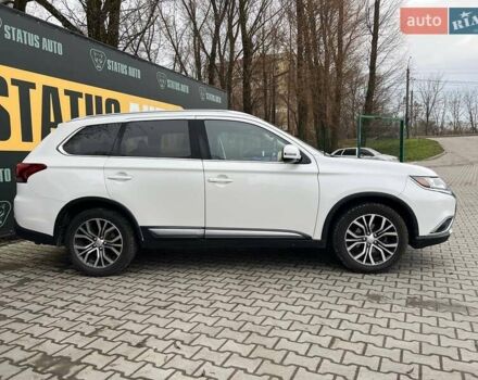 Белый Мицубиси Аутлендер, объемом двигателя 2.36 л и пробегом 153 тыс. км за 15700 $, фото 5 на Automoto.ua