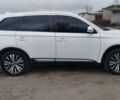Белый Мицубиси Аутлендер, объемом двигателя 2.4 л и пробегом 122 тыс. км за 17400 $, фото 3 на Automoto.ua