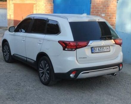 Белый Мицубиси Аутлендер, объемом двигателя 2.36 л и пробегом 98 тыс. км за 20500 $, фото 12 на Automoto.ua