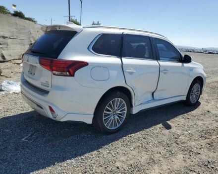 Белый Мицубиси Аутлендер, объемом двигателя 2 л и пробегом 54 тыс. км за 4200 $, фото 2 на Automoto.ua