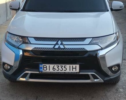 Белый Мицубиси Аутлендер, объемом двигателя 2.36 л и пробегом 98 тыс. км за 20500 $, фото 5 на Automoto.ua