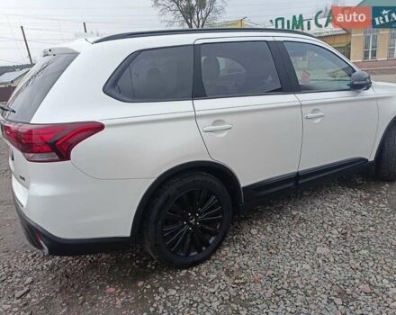 Білий Міцубісі Аутлендер, об'ємом двигуна 2.36 л та пробігом 170 тис. км за 18200 $, фото 2 на Automoto.ua