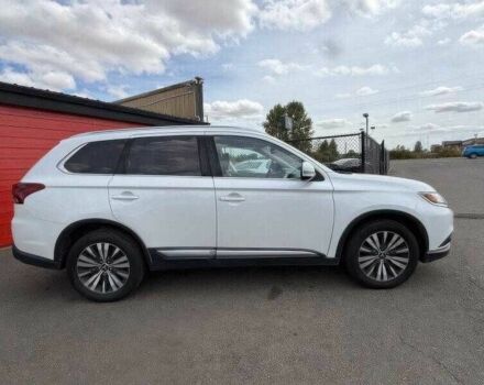 Белый Мицубиси Аутлендер, объемом двигателя 2.4 л и пробегом 65 тыс. км за 9500 $, фото 1 на Automoto.ua