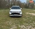 Белый Мицубиси Аутлендер, объемом двигателя 2.36 л и пробегом 77 тыс. км за 25700 $, фото 1 на Automoto.ua