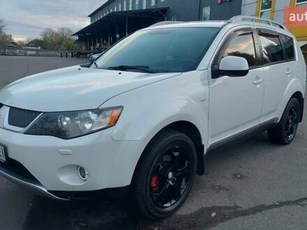 Белый Мицубиси Аутлендер, объемом двигателя 2.36 л и пробегом 185 тыс. км за 8950 $, фото 1 на Automoto.ua