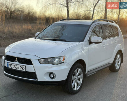 Белый Мицубиси Аутлендер, объемом двигателя 2.36 л и пробегом 161 тыс. км за 11700 $, фото 1 на Automoto.ua