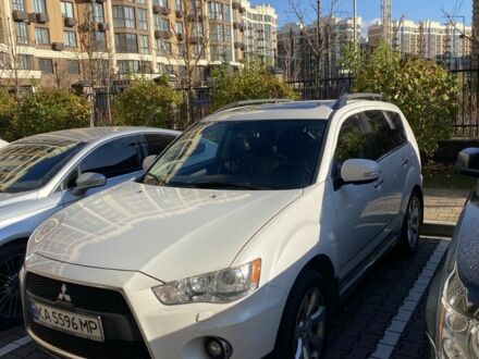 Белый Мицубиси Аутлендер, объемом двигателя 2.4 л и пробегом 154 тыс. км за 12500 $, фото 1 на Automoto.ua