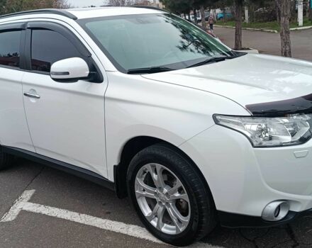 Белый Мицубиси Аутлендер, объемом двигателя 2.4 л и пробегом 112 тыс. км за 15000 $, фото 1 на Automoto.ua