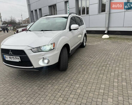 Белый Мицубиси Аутлендер, объемом двигателя 2.4 л и пробегом 180 тыс. км за 12500 $, фото 1 на Automoto.ua