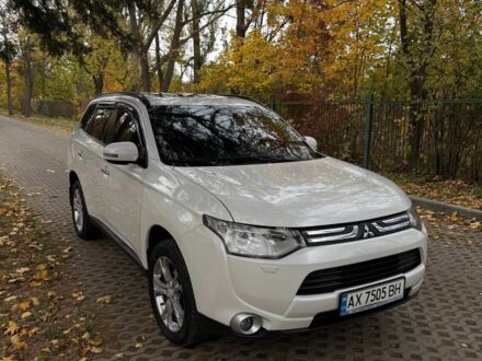 Белый Мицубиси Аутлендер, объемом двигателя 2.4 л и пробегом 146 тыс. км за 13500 $, фото 1 на Automoto.ua