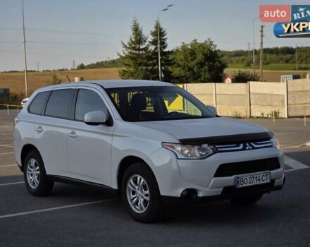 Белый Мицубиси Аутлендер, объемом двигателя 2.4 л и пробегом 183 тыс. км за 12499 $, фото 1 на Automoto.ua